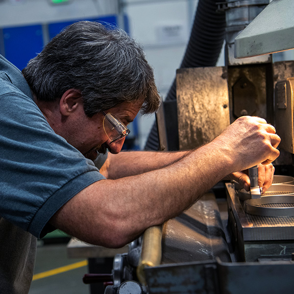 Primus employee working at machine